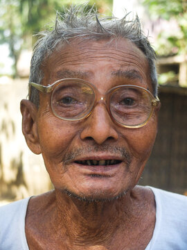 Close Up Portrait Of South Asian Aged Grandfather 