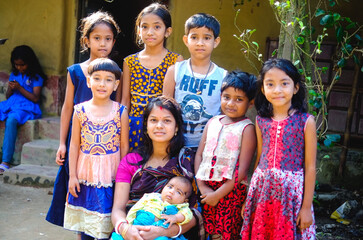 South asian hindu religious mother in outside of home with her little son