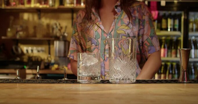 Bartender making drinks in warm bar
