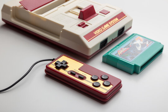 famicom game console with cartridge and controller
