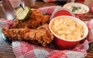Fried chicken tenders with a side of macaroni and cheese