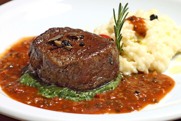 Truffled beef medallion with spinach cream and cheese risotto