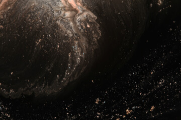 Abstract  black background. Marble flow texture. Acrylic color in water and oil.