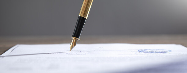 Pen signing in contract. Business