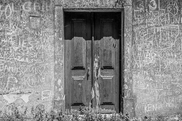 Minimalist picutre of a door and wall covered in graffiti in Sintra Portugal