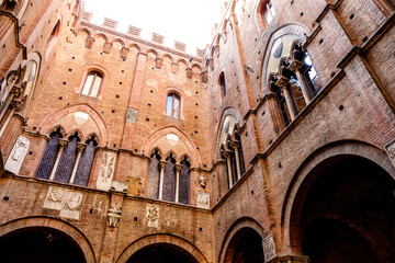 Fototapeta premium Interior courtyard of the city hall (in italian: Palazzo Comunale or Palazzo Pubblico) in Siena, Tuscany, Italy, Europe