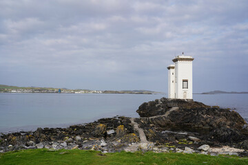 Fototapeta na wymiar The Carraig Fhada lighthouse near Port Ellen on the isle of Islay