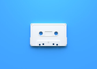 Fototapeta premium Vintage audio tape cassette on a blue background. Top view with copy space. 3d rendering illustration