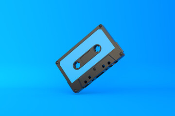 Vintage audio tape cassette on a blue background. Front view with copy space. 3d rendering illustration