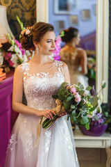 Happy newlywed woman. Bride with wedding makeup and hairstyle. Smiling bride. Wedding day. Gorgeous bride. Marriage.
