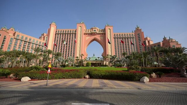 Tilt Down Shot Of Entrance Of Atlantis, The Palm Hotel Against Clear Sky On Sunny Day - Dubai, United Arab Emirates
