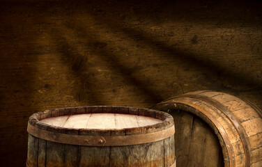 Beer. Still life with Vintage beer barrel and glass light beer. Fresh amber beer concept. Green hop...