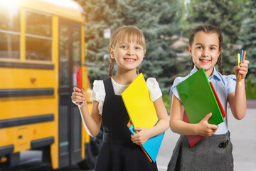 Little kids schoolchildren pupils students, the school bus. Welcome back to school. The new academic semester year start