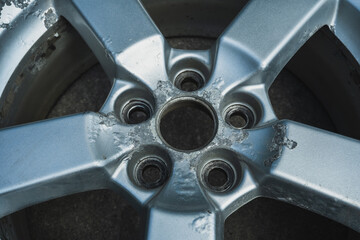 Corrosion on a silver aluminum alloy wheel close-up