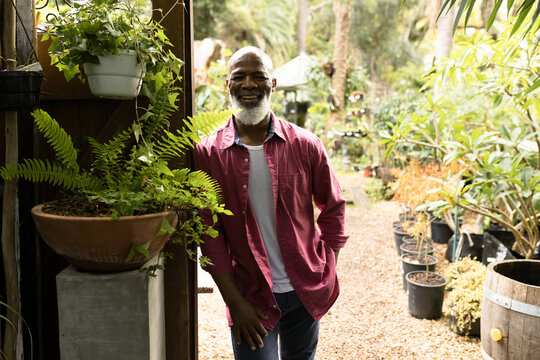 Portrait of happy senior african american man in garden