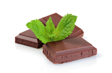 Chocolate bars with green mint leaves, isolated on white background
