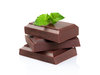 Chocolate bars with green mint leaves, isolated on white background