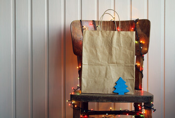 Festive background with a paper bag. New Year, Christmas.