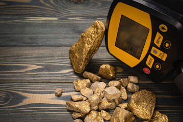 Metal detector and golden ore concept. Treasure hunting.