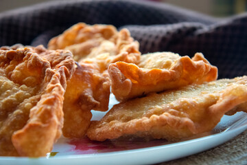 deep-fried golden chebureks or dumplings are laid out on a plate