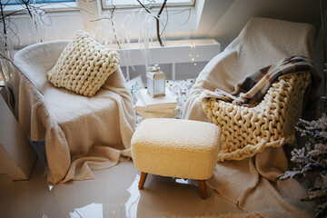 Fototapeta na wymiar Concept of vintage armchair and white knitted bedspread and pillows in apartment. 
