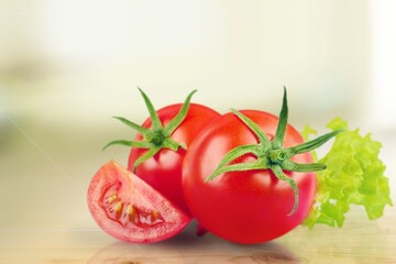 Tasty ripe fresh red tomatoes on the desk