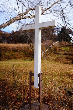 A White Wooden Christian Cross Stands In A Sacred Area Outside Of Fond Du Lac, Wisconsin County