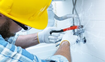 Technician plumber using a wrench to repair. Concept of maintenance, fix water plumbing leaks,...