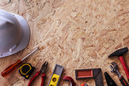 Different construction tools with Hand tools for home renovation on wooden board maintenance and reparing concept