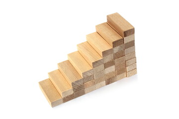 Tower of wooden blocks on a white background in the form of stairs.