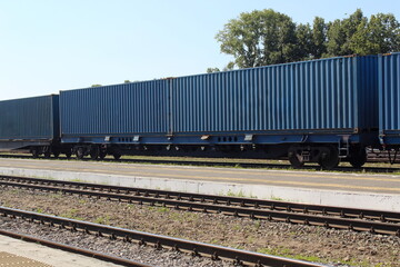 Railway station with freight cars on a summer day.