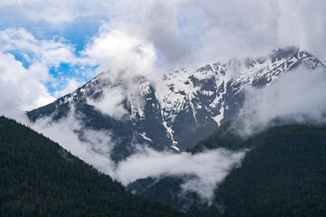 Misty view of Mt Menzies seen from cruise ship in the Discovery Passage in British Columbia