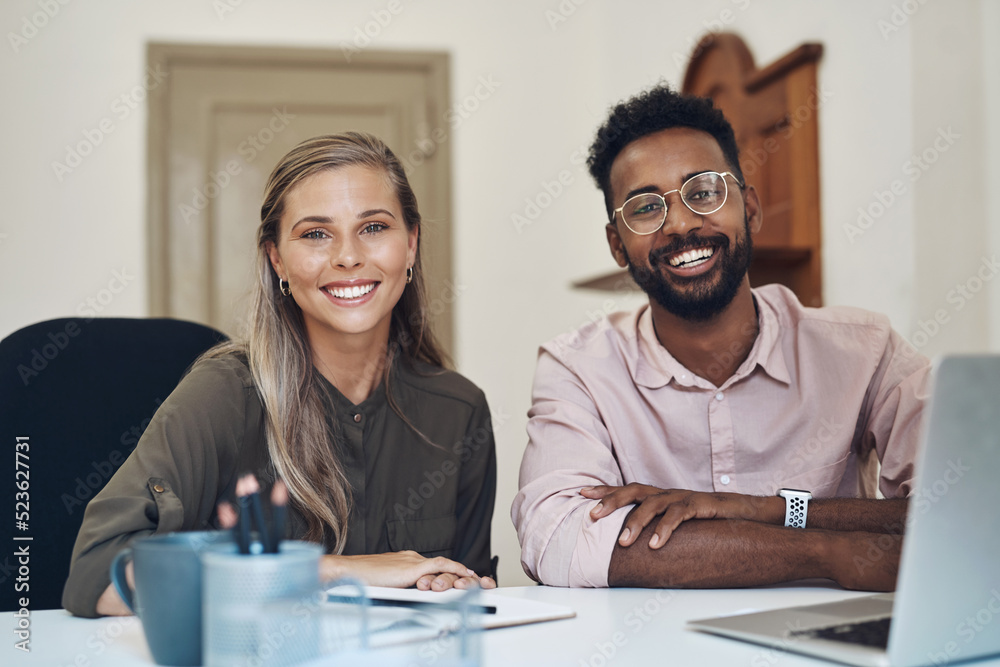 Aufkleber happy diverse employees working together on a project sitting in an office table satisfied with the 