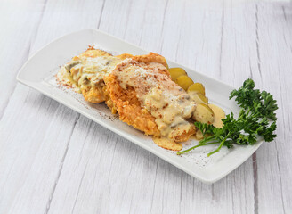 Chicken Steak served in dish isolated on grey wooden background side view of fastfood
