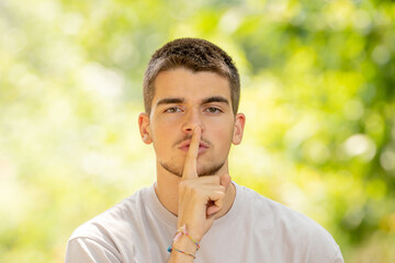 young man with silence expression outdoors