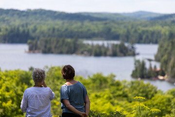 Fototapeta premium Two women are looking at a beautiful landscape