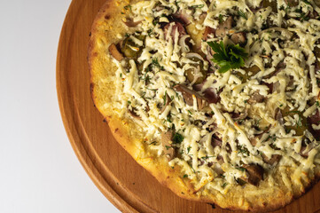 Pizza food background. Homemade Neapolitan pizza with mozzarella cheese and tomato sauce on a rustic wooden table isolated on a white background. Italian food.