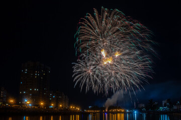 fireworks over the river in the city