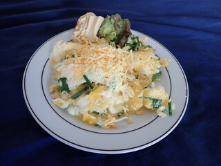 scrabbled eggs with vegetales served on a plate
