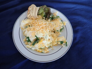 scrabbled eggs with vegetales served on a plate