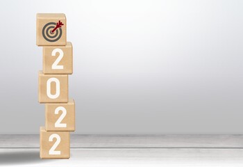2022 Happy New year banner. Business goal and target sign concept on desk