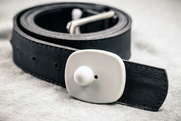anti-theft device used in commerce, anti-theft tag or tag attached to a belt, clothing protected against theft, retail trade
