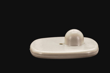 anti-theft tag or tag, security tag with sensor for commerce, isolated black background