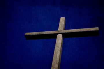 wood cross with texture effect and deep blue