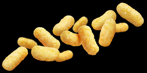 Flying corn sticks, isolated on black background