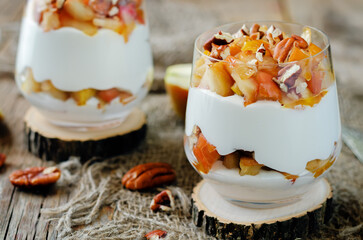 Caramelized apple pecan greek yogurt parfait in a glass