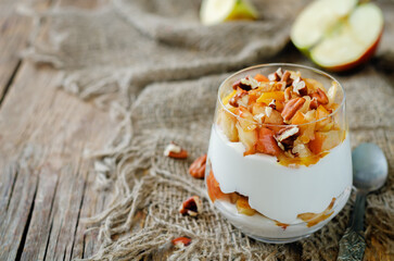 Caramelized apple pecan greek yogurt parfait in a glass
