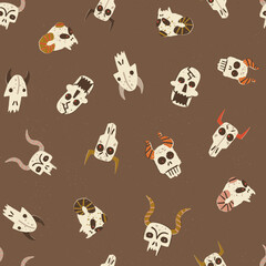 Halloween alive skulls vector seamless pattern. Magical creatures, devils, horned monster's skulls with burning eyes.