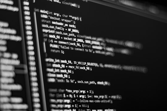 Black and white Code background. Android programming code with Java language is on the screen.