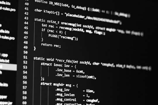Black and white Code background. Java programming code with Java language is on the screen.